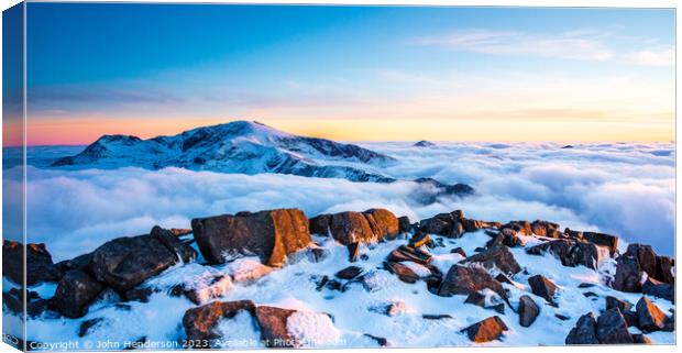 Snowdonia panorama. Snowdon above the clouds. Canvas Print by John Henderson