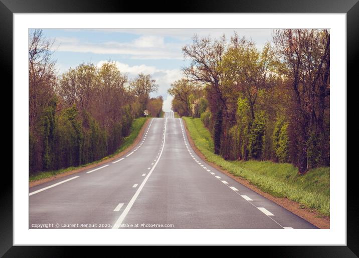 Traveling on a rural french country road Framed Mounted Print by Laurent Renault