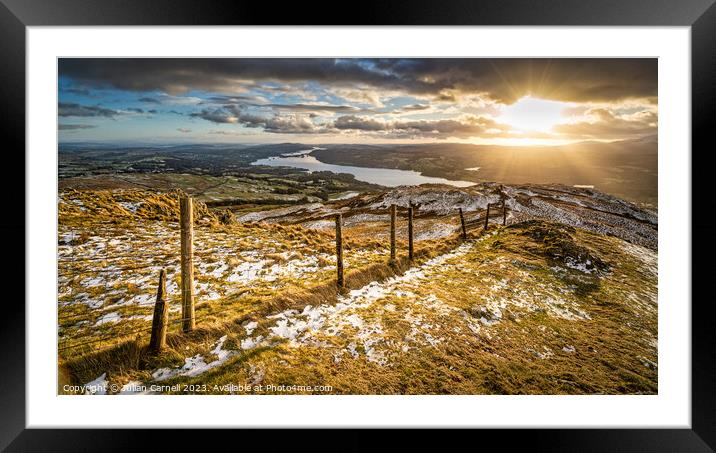 Wansfell Pike sunset with Windermere in the background Framed Mounted Print by Julian Carnell