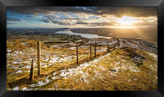 Wansfell Pike sunset with Windermere in the background Framed Print by Julian Carnell