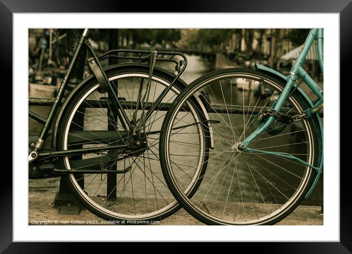 Close up of two bicycle wheels Framed Mounted Print by Alan Collins