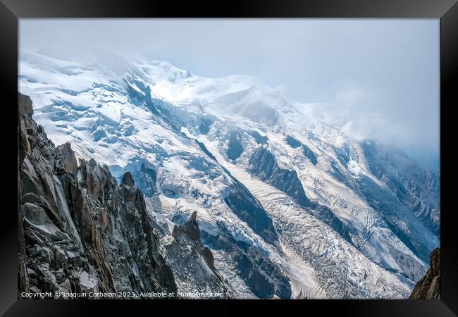 Spectacular mountain crags between glaciers in the alps. Framed Print by Joaquin Corbalan