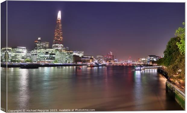View of the London skyline at night with river thamse and lots of light Canvas Print by Michael Piepgras