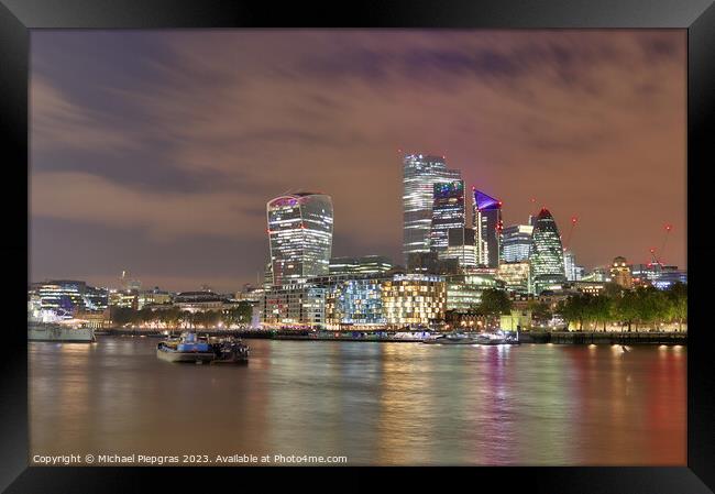 View of the London skyline at night with river thamse and lots of light Framed Print by Michael Piepgras