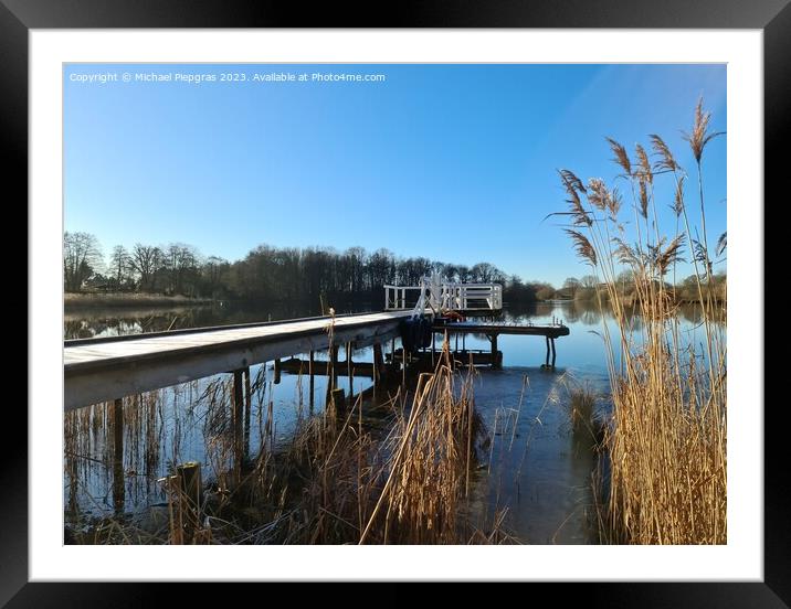 Beautiful landscape on a jetty by a lake with blue sky. Framed Mounted Print by Michael Piepgras