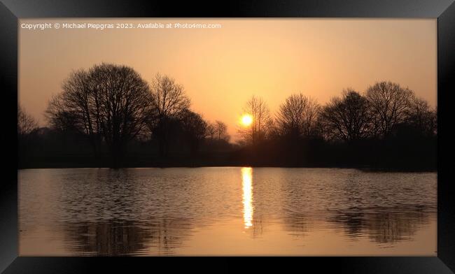 Beautiful and romantic sunset at a lake in stunning yellow and o Framed Print by Michael Piepgras