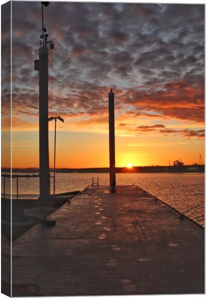 Walking into the sunset rise over Brightlingsea Ha Canvas Print by Tony lopez