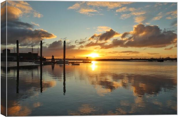 Sunrise reflections over Brightlingsea Harbour  Canvas Print by Tony lopez