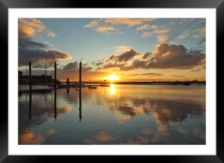 Sunrise reflections over Brightlingsea Harbour  Framed Mounted Print by Tony lopez