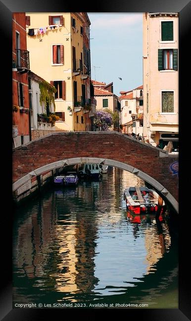 Bridge over canal Venice  Framed Print by Les Schofield