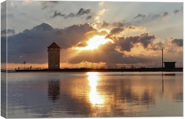 Sun setting over Batemans Tower in Brightlingsea  Canvas Print by Tony lopez
