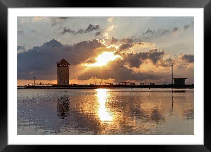 Sun setting over Batemans Tower in Brightlingsea  Framed Mounted Print by Tony lopez