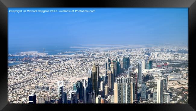 Aerial view over the city center of dubai on a sunny day Framed Print by Michael Piepgras
