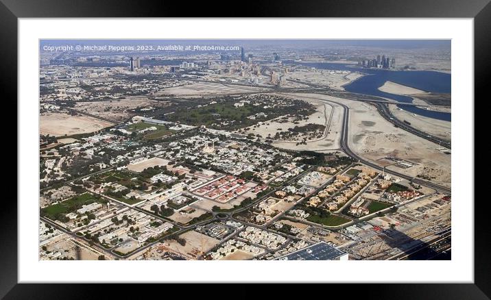 Aerial view over the city center of dubai on a sunny day Framed Mounted Print by Michael Piepgras