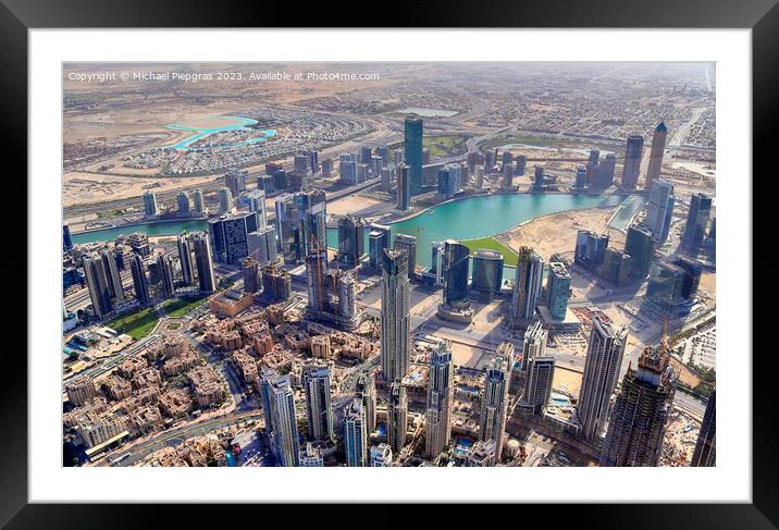 Aerial view over the city center of dubai on a sunny day Framed Mounted Print by Michael Piepgras