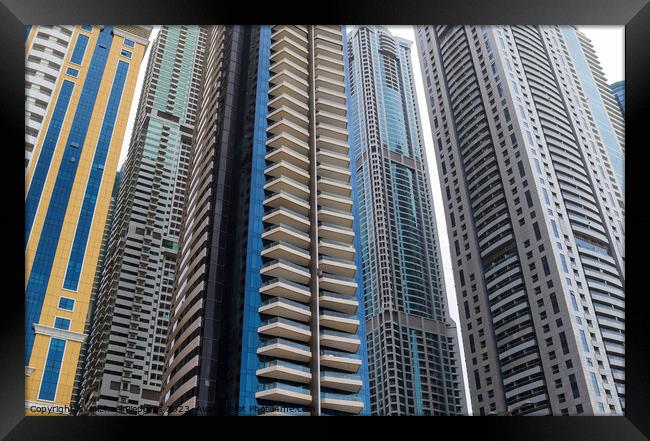 Luxury modern skyscrapers in the center of Dubai city. United Ar Framed Print by Michael Piepgras