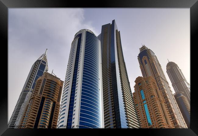 Luxury modern skyscrapers in the center of Dubai city. United Ar Framed Print by Michael Piepgras