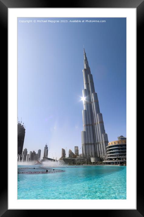 View at the Burj Khalifa on a sunny day. Burj Khalifa is currently the tallest building in the world, at 829.84 m (2,723 ft) Framed Mounted Print by Michael Piepgras