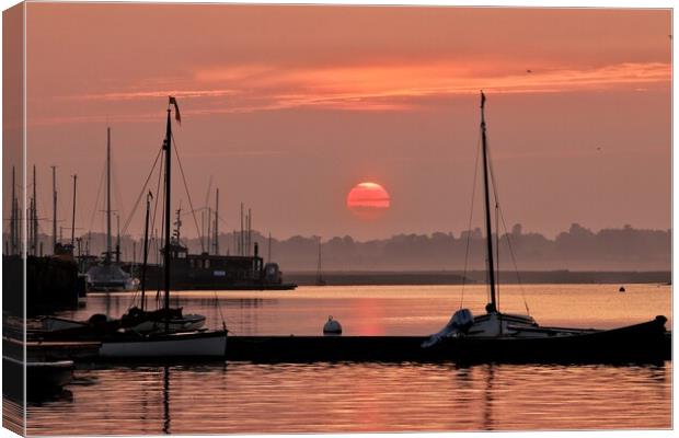 Red sunrise over Brightlingsea Harbour  Canvas Print by Tony lopez