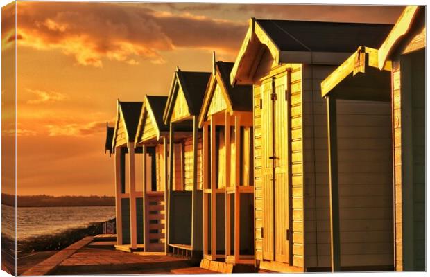 Beach hut sunset reflections over Brightlingsea  Canvas Print by Tony lopez