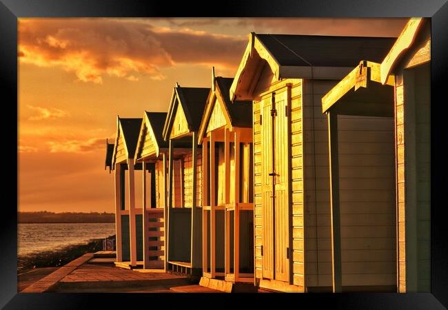 Beach hut sunset reflections over Brightlingsea  Framed Print by Tony lopez