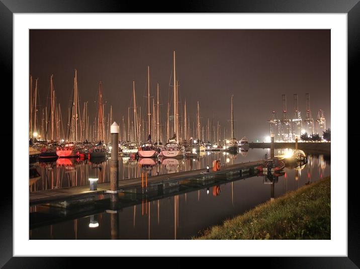 Evening light reflections over the Shotley marina  Framed Mounted Print by Tony lopez