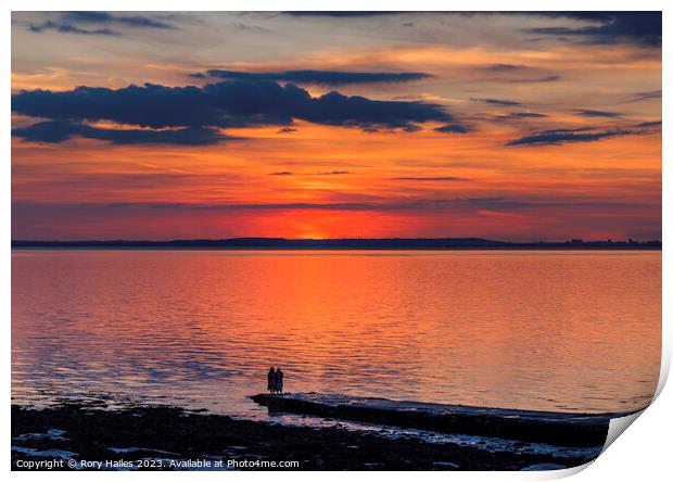 Sunset over the Bristol channel with reddish reflection in the sky and reflecting onto the sea Print by Rory Hailes