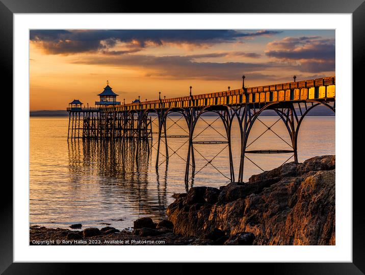 Clevedon Pier at Sunset with the pier side panels catching the sunlight Framed Mounted Print by Rory Hailes