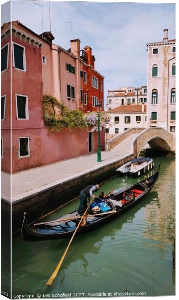 Gondola on the Venice canal  Canvas Print by Les Schofield