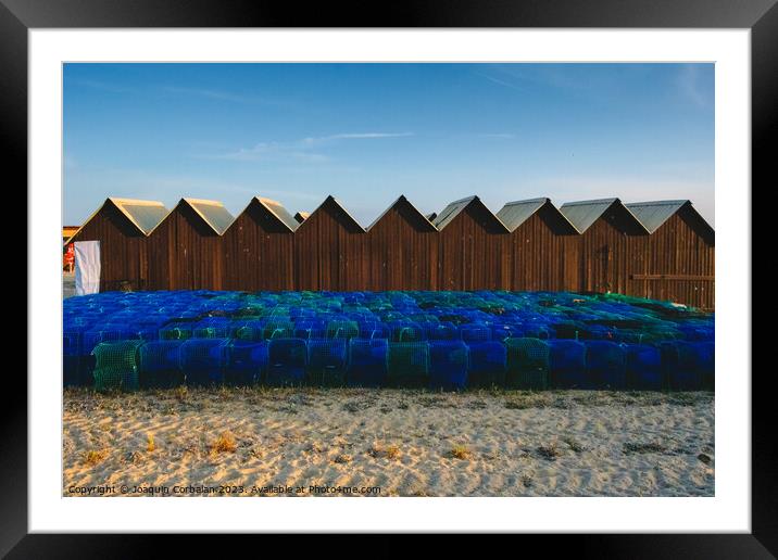Pots, baskets and traps for fishing, piled up on the coast. Framed Mounted Print by Joaquin Corbalan