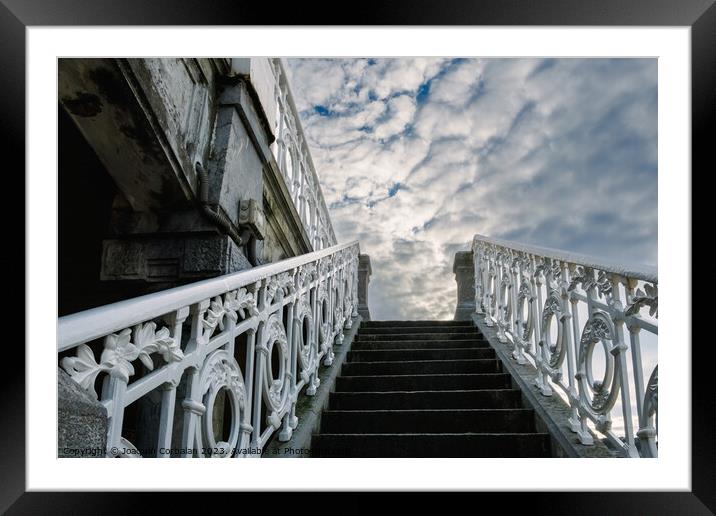 Ancient decorated staircase with beautiful handrails goes up tow Framed Mounted Print by Joaquin Corbalan