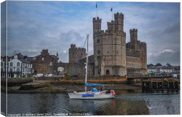Caernarfon Castle and the Yacht Canvas Print by Richard Perks