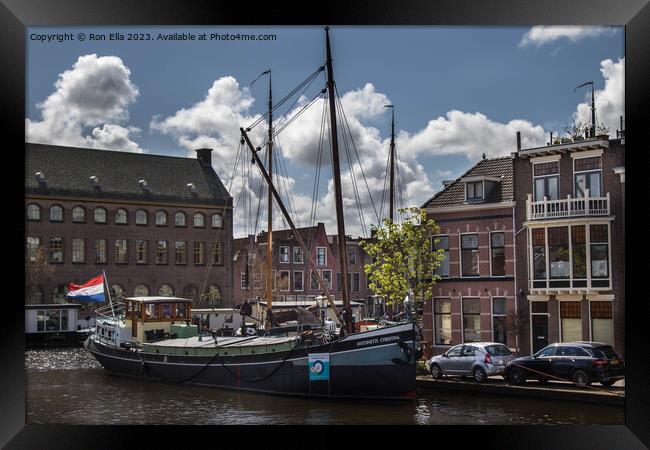 Navigating Leiden's Historic Harbor Framed Print by Ron Ella