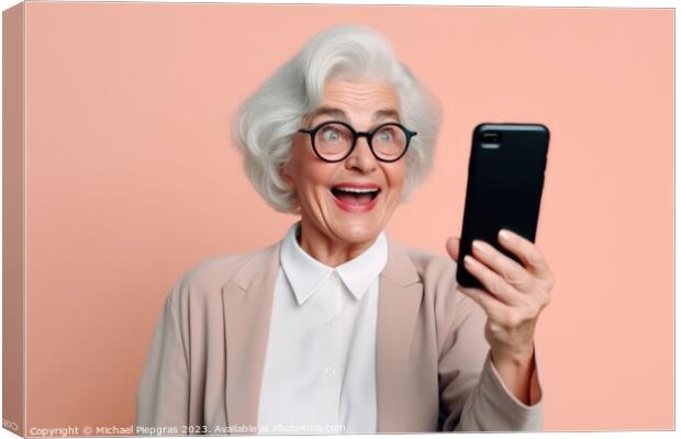 A happy retired old woman holding a smartphone in her hands crea Canvas Print by Michael Piepgras