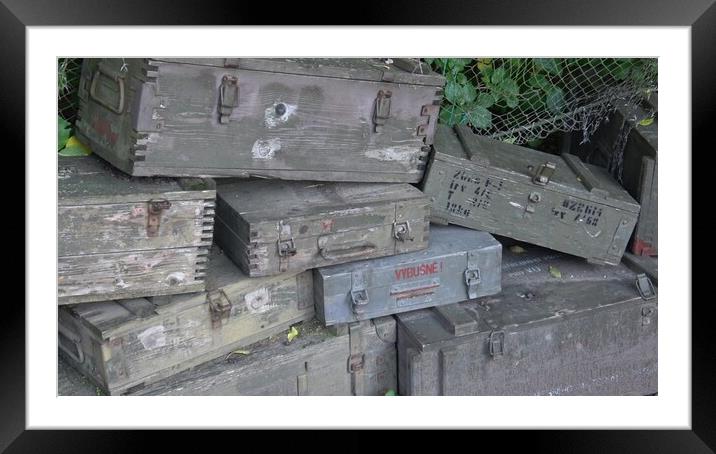 A stack of old wooden military green boxes with ammunition. Framed Mounted Print by Irena Chlubna
