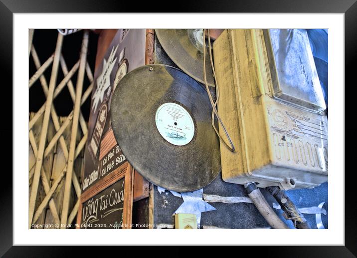 Saigon Vinyl  Framed Mounted Print by Kevin Plunkett