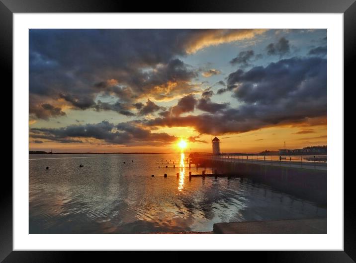 Sunset colours over Batemans Tower in Brightlingsea  Framed Mounted Print by Tony lopez