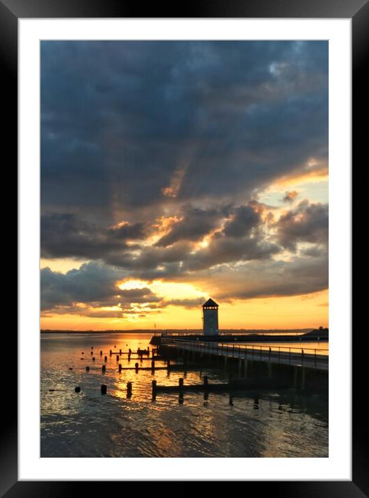 Sunset over Batemans tower in Brightlingsea essex  Framed Mounted Print by Tony lopez