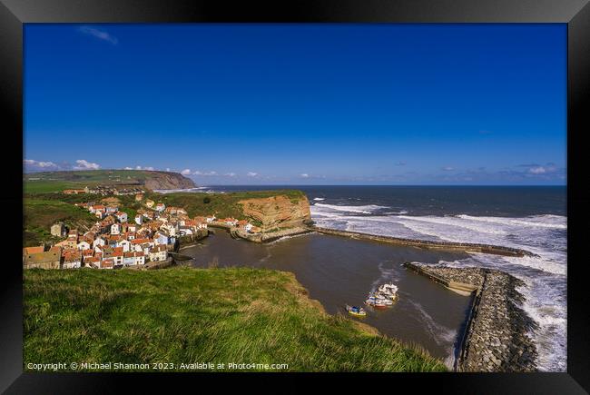 Clifftop view of Staithes from the Cleveland Way Framed Print by Michael Shannon