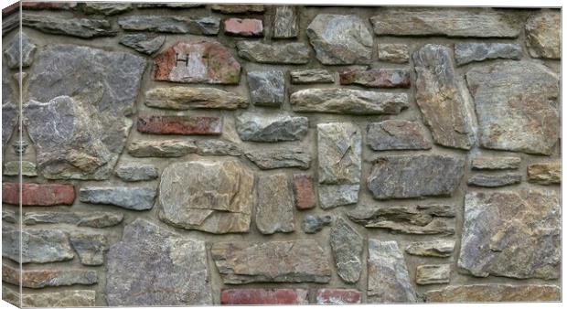 Masonry wall of multicolored stones or blocks Canvas Print by Irena Chlubna