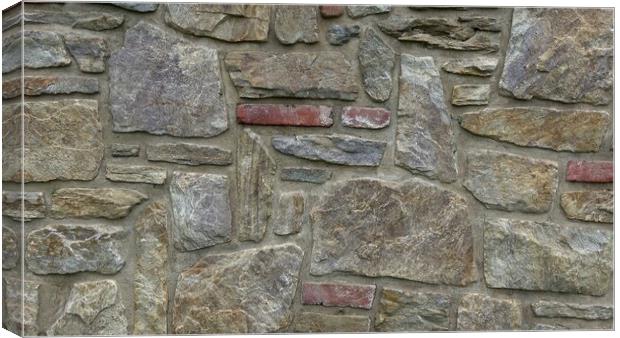 Masonry wall of multicolored stones or blocks Canvas Print by Irena Chlubna