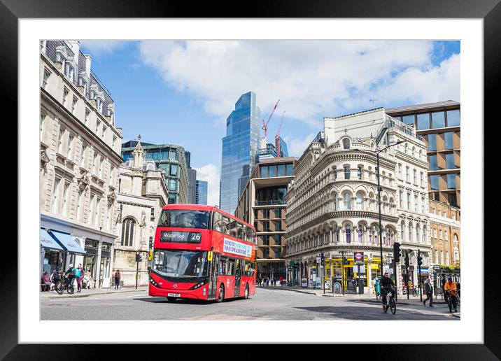 A Red Iconic London Bus Travelling Across Queen Vi Framed Mounted Print by Jason Wells