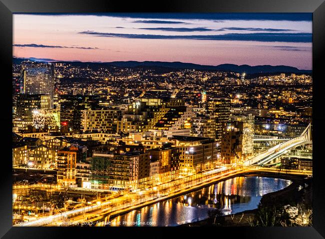 The Citylights Of Oslo, Norway From The Ekesberg S Framed Print by Peter Greenway