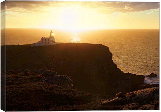 A hazy sunset over Stoer Lighthouse Canvas Print by Anthony McGeever