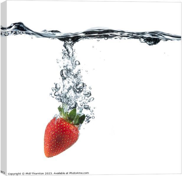 Vibrant Red Strawberry Dropped in Clear Water Canvas Print by Phill Thornton