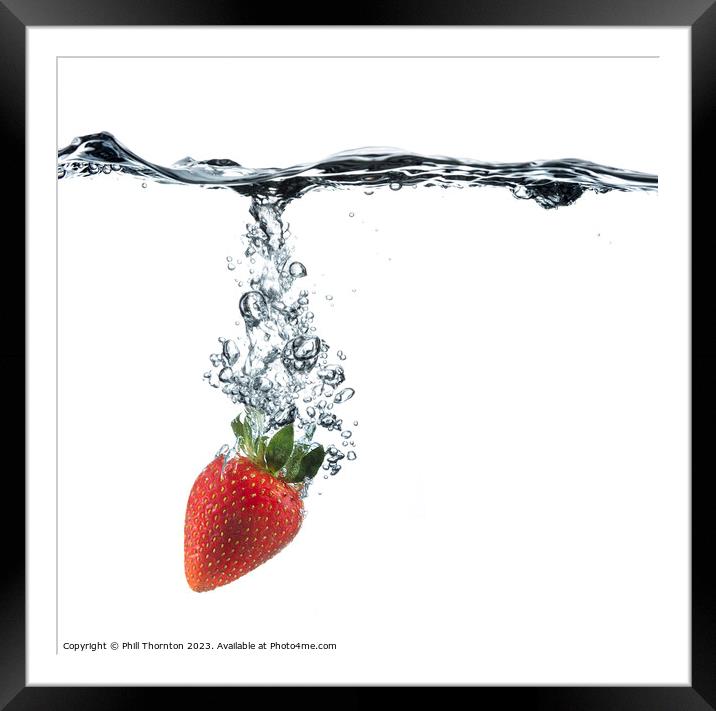 Vibrant Red Strawberry Dropped in Clear Water Framed Mounted Print by Phill Thornton
