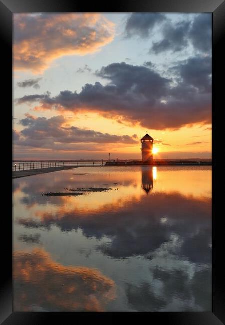 Skyscape sunset reflections over Batemans Tower  Brightlingsea  Framed Print by Tony lopez