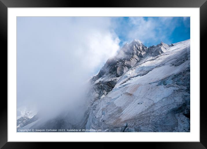 Rugged and dangerous mountain peaks high in the Alps losing thei Framed Mounted Print by Joaquin Corbalan