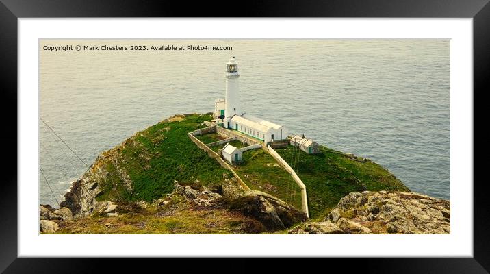 South Stack lighthouse from the cliff Framed Mounted Print by Mark Chesters