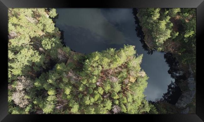 Lake surrounded by trees. Beautiful landscape in aerial drone shot. Framed Print by Irena Chlubna